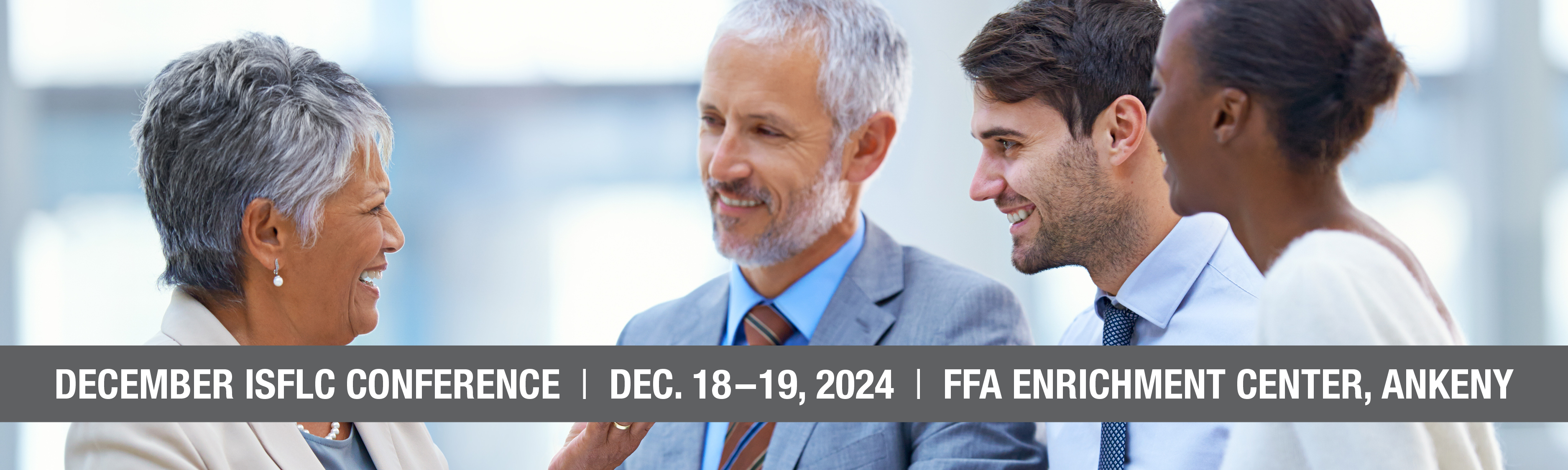 Register for the December ISFLC Conference, which is being held December 18–19 at the FFA Enrichment Center in Ankeny! Image shows a small group of business people smiling and talking.